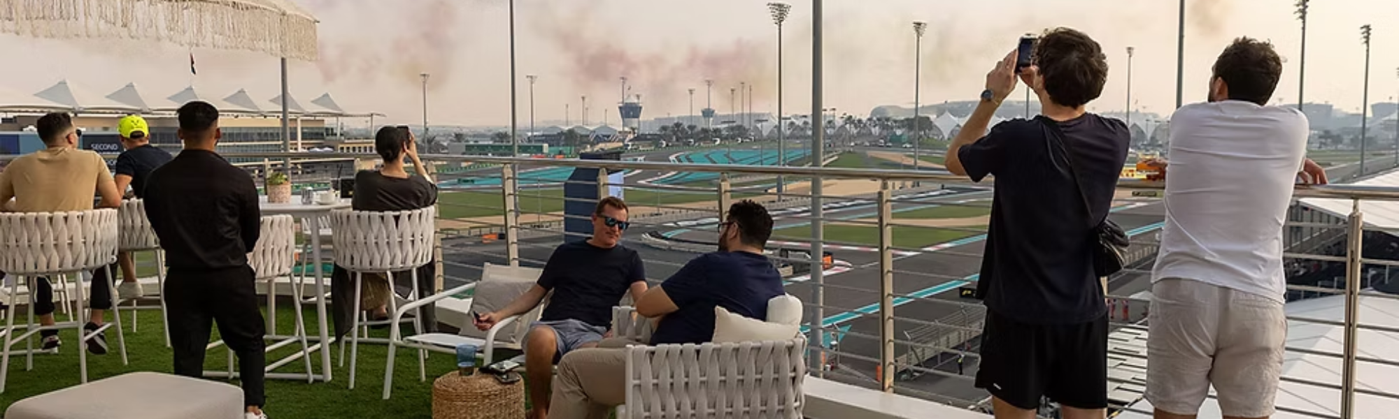 two men sitting on a balcony